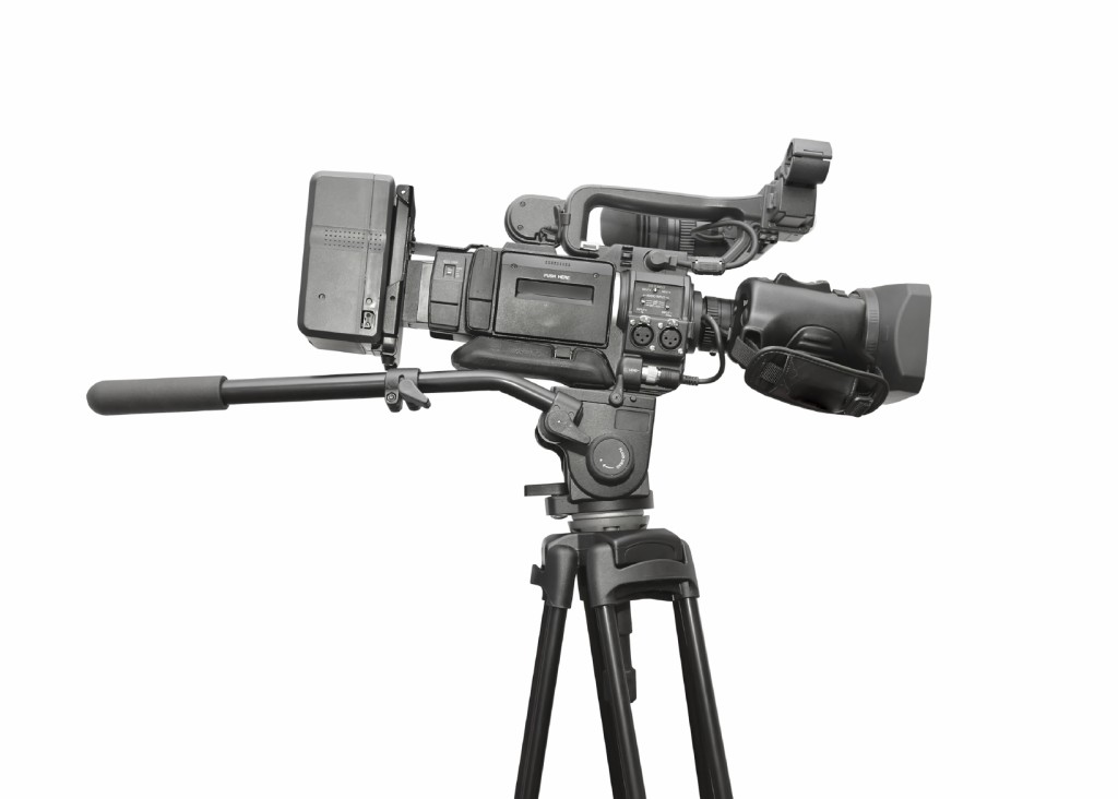 Professional video camera. White background