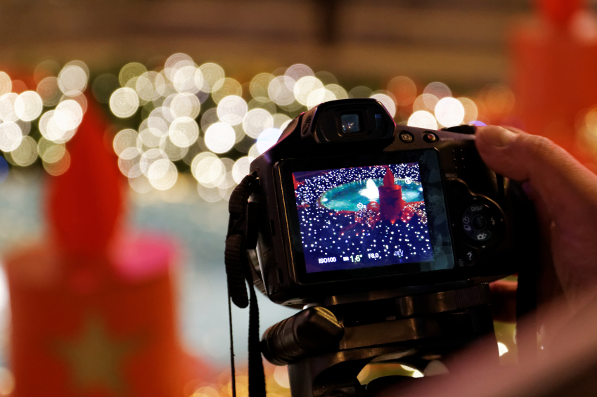 Camera shooting a fountain decorated for Christmas iStock_000032377448_Small