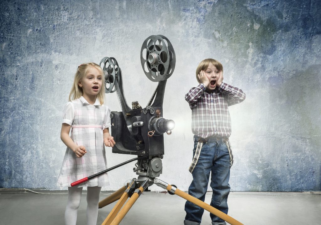 Children Being Amazed by a Cine Projector