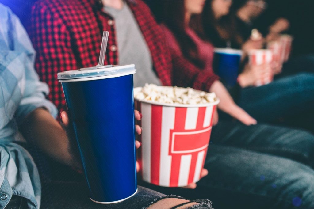 Friends at the cinema with snacks